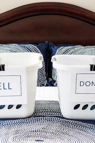 laundry baskets on a bed labeled "sell" and "donate".