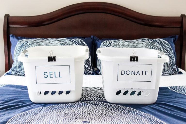 laundry baskets on a bed labeled "sell" and "donate".