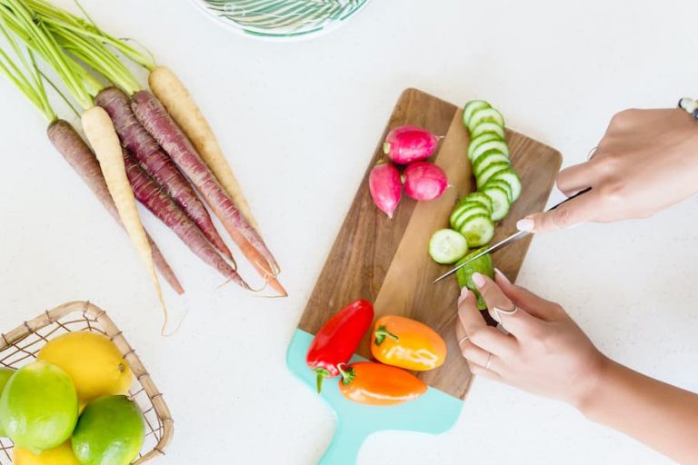 prepping vegatables on a cutting board.