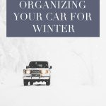 SUV driving in the snow with text overlay "The Ultimate Guide to Organizing Your Car For Winter"