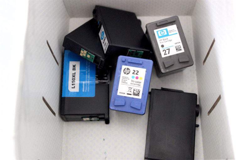 box of empty printer ink cartridges.