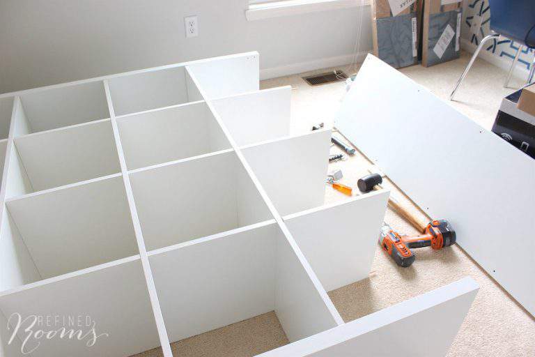 partially assembled Ikea Kallax bookshelf.