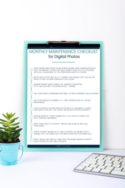 blue clipboard with Monthly Maintenance Checklist for Digital Photos attached.
