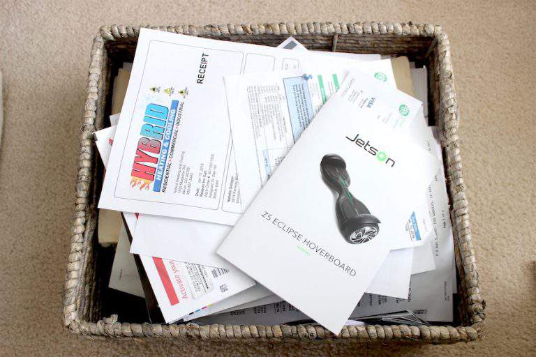 a basket full of household paper clutter