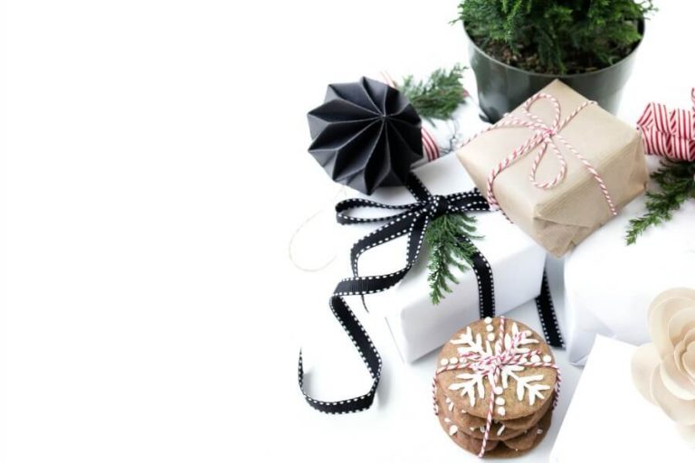 pile of holiday cookies and wrapped gifts.