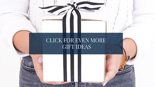 woman holding a gift - text overlay "Click for even more gift ideas"