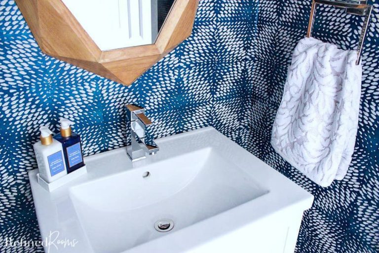 square white porcelain modern sink with soap and patterned hand towel.