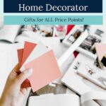 hand holding up paint swatches - "This Year's Best Gifts for the DIY Home Decorator".