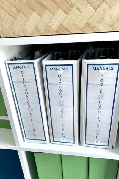 set of product manual binders stored on a shelf.
