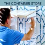 Man installing Elfa Shelving - text "How to install an Elfa shelving system from the Container Store".