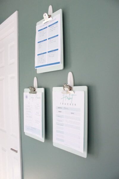 sideways view of clipboard wall for paper storage in a home office.