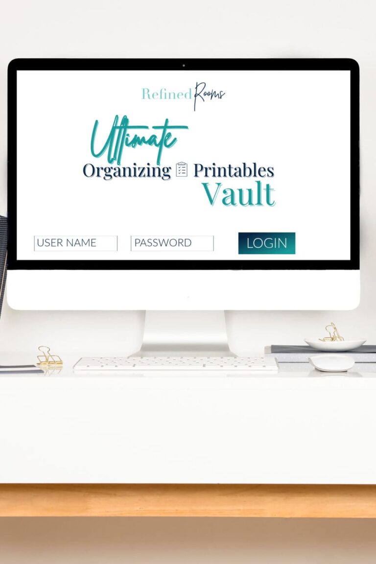 iMac on a desk with login screen for Ultimate Organizing Printables Vault displayed.